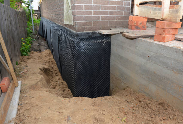 Happy homeowners after waterproofing job in Winamac